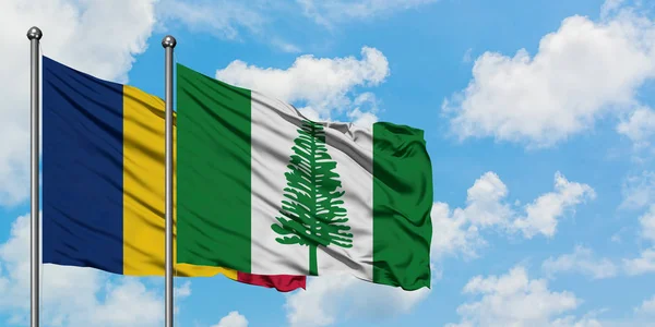 Chad and Norfolk Island flag waving in the wind against white cloudy blue sky together. Diplomacy concept, international relations. — Stock Photo, Image