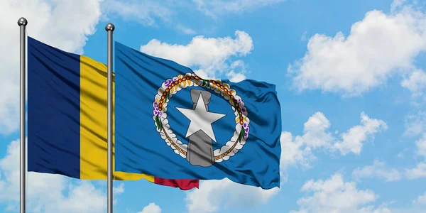 Chad and Northern Mariana Islands flag waving in the wind against white cloudy blue sky together. Diplomacy concept, international relations. — Stock Photo, Image