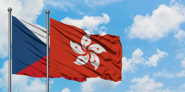 Bandera de la República Checa y Hong Kong ondeando en el viento contra el cielo azul nublado blanco juntos. Concepto diplomático, relaciones internacionales . —  Fotos de Stock