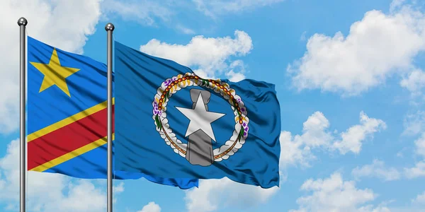 Congo and Northern Mariana Islands flag waving in the wind against white cloudy blue sky together. Diplomacy concept, international relations. — Stock Photo, Image