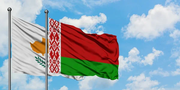 Cyprus and Belarus flag waving in the wind against white cloudy blue sky together. Diplomacy concept, international relations. — Stock Photo, Image