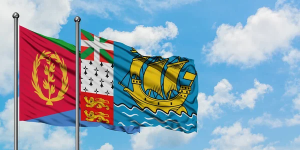 Eritrea and Saint Pierre And Miquelon flag waving in the wind against white cloudy blue sky together. Diplomacy concept, international relations. — Stock Photo, Image