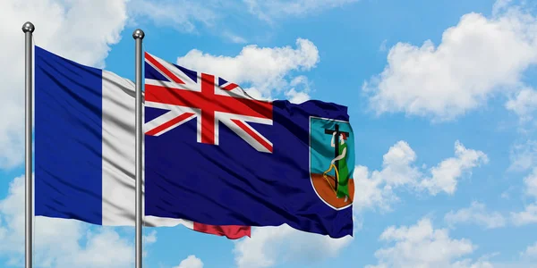 Bandera de Francia y Montserrat ondeando en el viento contra el cielo azul nublado blanco juntos. Concepto diplomático, relaciones internacionales . — Foto de Stock