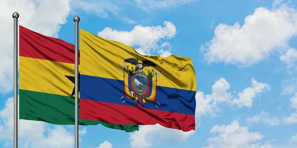 Ghana and Ecuador flag waving in the wind against white cloudy blue sky together. Diplomacy concept, international relations. — Stock Photo, Image