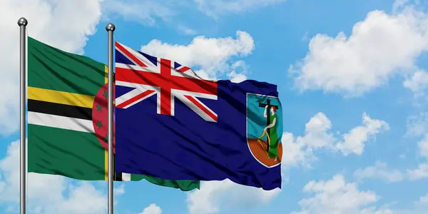 Dominica och Montserrat flagga vinka i vinden mot vit grumlig blå himmel tillsammans. Diplomatisk koncept, internationella relationer. — Stockfoto