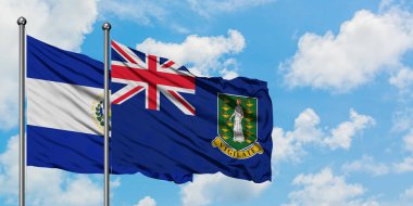 El Salvador ve İngiliz Virgin Adaları bayrağı birlikte beyaz bulutlu mavi gökyüzüne karşı rüzgarda sallayarak. Diplomasi kavramı, uluslararası ilişkiler.