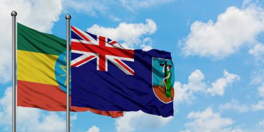 Etiyopya ve Montserrat bayrağı birlikte beyaz bulutlu mavi gökyüzüne karşı rüzgarda sallayarak. Diplomasi kavramı, uluslararası ilişkiler.