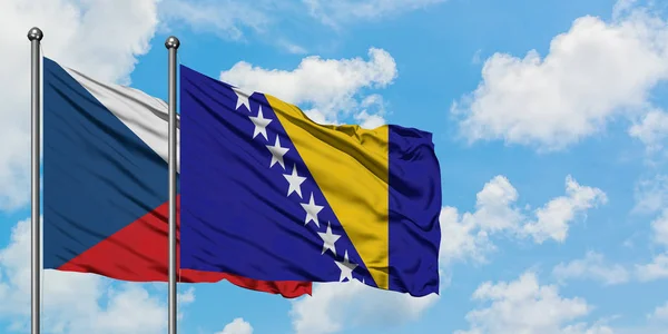 República Checa e Bósnia Herzegovina bandeira acenando no vento contra o céu azul nublado branco juntos. Conceito de diplomacia, relações internacionais . — Fotografia de Stock