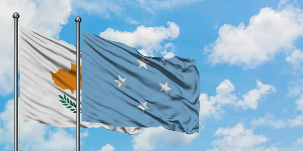 Cyprus and Micronesia flag waving in the wind against white cloudy blue sky together. Diplomacy concept, international relations. — Stock Photo, Image