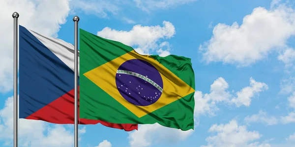 Czech Republic and Brazil flag waving in the wind against white cloudy blue sky together. Diplomacy concept, international relations. — Stock Photo, Image