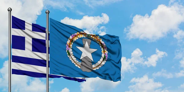 Greece and Northern Mariana Islands flag waving in the wind against white cloudy blue sky together. Diplomacy concept, international relations. — Stock Photo, Image