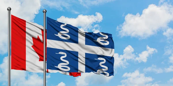 Bandera de Canadá y Martinica ondeando en el viento contra el cielo azul nublado blanco juntos. Concepto diplomático, relaciones internacionales . — Foto de Stock