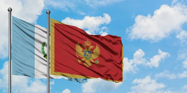 Guatemala e Montenegro sventolano bandiera nel vento contro bianco cielo blu nuvoloso insieme. Concetto di diplomazia, relazioni internazionali . — Foto Stock
