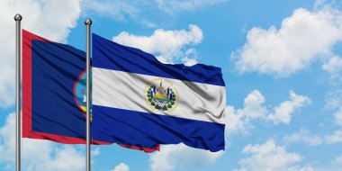 Guam ve El Salvador bayrağı birlikte beyaz bulutlu mavi gökyüzüne karşı rüzgarda sallayarak. Diplomasi kavramı, uluslararası ilişkiler.