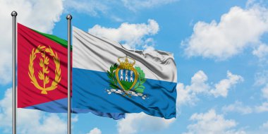Eritre ve San Marino bayrağı birlikte beyaz bulutlu mavi gökyüzüne karşı rüzgarda sallayarak. Diplomasi kavramı, uluslararası ilişkiler.