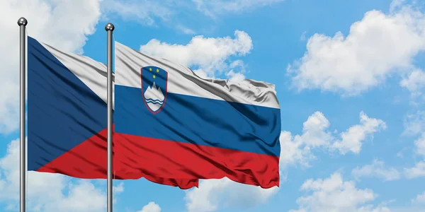 Czech Republic and Slovenia flag waving in the wind against white cloudy blue sky together. Diplomacy concept, international relations. — Stock Photo, Image