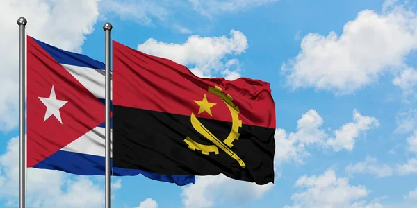 Bandera de Cuba y Angola ondeando en el viento contra el cielo azul nublado blanco juntos. Concepto diplomático, relaciones internacionales . —  Fotos de Stock