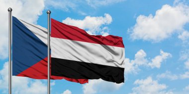 Çek Cumhuriyeti ve Yemen bayrağı birlikte beyaz bulutlu mavi gökyüzüne karşı rüzgarda sallayarak. Diplomasi kavramı, uluslararası ilişkiler.