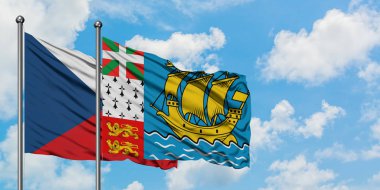 Çek Cumhuriyeti ve Saint Pierre ve Miquelon bayrağı birlikte beyaz bulutlu mavi gökyüzüne karşı rüzgarda sallayarak. Diplomasi kavramı, uluslararası ilişkiler.