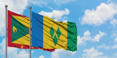 Grenada ve Saint Vincent ve Grenadinler bayrak birlikte beyaz bulutlu mavi gökyüzüne karşı rüzgarda sallayarak. Diplomasi kavramı, uluslararası ilişkiler.