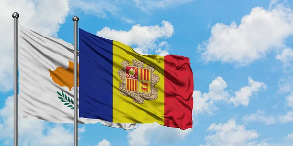 Kypr a Andorra vlají ve větru proti bíle zatažené modré obloze. Diplomacie, mezinárodní vztahy. — Stock fotografie