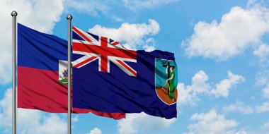 Haiti ve Montserrat bayrağı birlikte beyaz bulutlu mavi gökyüzüne karşı rüzgarda sallayarak. Diplomasi kavramı, uluslararası ilişkiler.