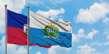 Haiti ve San Marino bayrağı birlikte beyaz bulutlu mavi gökyüzüne karşı rüzgarda sallayarak. Diplomasi kavramı, uluslararası ilişkiler.