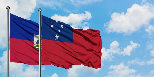 Haiti and Samoa flag waving in the wind against white cloudy blue sky together. Diplomacy concept, international relations. — Stock Photo, Image
