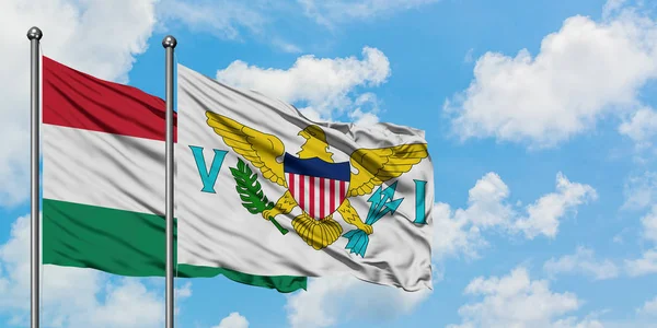 Ungern och Amerikanska Jungfruöarna flagga vifta i vinden mot vit grumlig blå himmel tillsammans. Diplomatisk koncept, internationella relationer. — Stockfoto