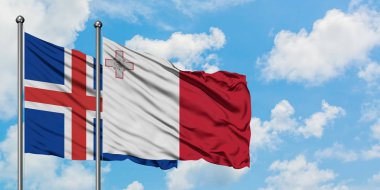 İzlanda ve Malta bayrağı birlikte beyaz bulutlu mavi gökyüzüne karşı rüzgarda sallayarak. Diplomasi kavramı, uluslararası ilişkiler.