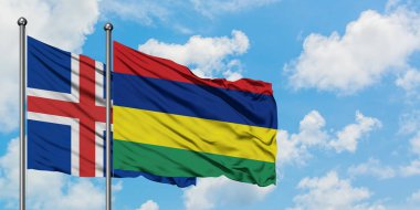 İzlanda ve Mauritius bayrağı birlikte beyaz bulutlu mavi gökyüzüne karşı rüzgarda sallayarak. Diplomasi kavramı, uluslararası ilişkiler.