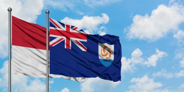 Irak ve Anguilla bayrağı birlikte beyaz bulutlu mavi gökyüzüne karşı rüzgarda sallayarak. Diplomasi kavramı, uluslararası ilişkiler.