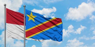 Irak ve Kongo bayrağı birlikte beyaz bulutlu mavi gökyüzüne karşı rüzgarda sallayarak. Diplomasi kavramı, uluslararası ilişkiler.