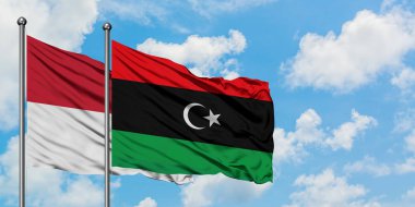 Irak ve Libya bayrağı havada havada sallanıyor. Diplomasi kavramı, uluslararası ilişkiler.