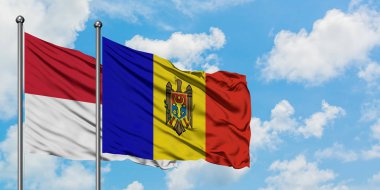 Irak ve Moldova bayrağı birlikte beyaz bulutlu mavi gökyüzüne karşı rüzgarsal sallayarak. Diplomasi kavramı, uluslararası ilişkiler.