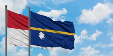 Irak ve Nauru bayrağı birlikte beyaz bulutlu mavi gökyüzüne karşı rüzgarda sallayarak. Diplomasi kavramı, uluslararası ilişkiler.