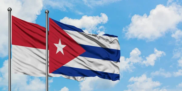 Iraq and Cuba flag waving in the wind against white cloudy blue sky together. Diplomacy concept, international relations. — Stock Photo, Image