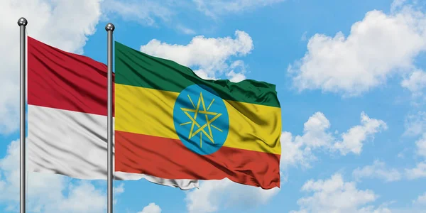 Iraq and Ethiopia flag waving in the wind against white cloudy blue sky together. Diplomacy concept, international relations. — Stock Photo, Image