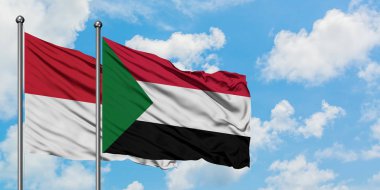 Irak ve Sudan bayrağı havada havada sallanıyor. Diplomasi kavramı, uluslararası ilişkiler.