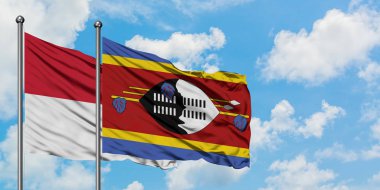 Irak ve Svaziland bayrağı birlikte beyaz bulutlu mavi gökyüzüne karşı rüzgarda sallayarak. Diplomasi kavramı, uluslararası ilişkiler.