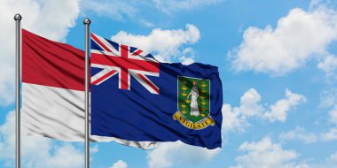 Irak ve İngiliz Virgin Adaları bayrağı birlikte beyaz bulutlu mavi gökyüzüne karşı rüzgarda sallayarak. Diplomasi kavramı, uluslararası ilişkiler.