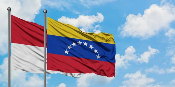 Iraq and Venezuela flag waving in the wind against white cloudy blue sky together. Diplomacy concept, international relations. — Stock Photo, Image