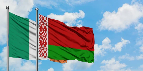 Ireland and Belarus flag waving in the wind against white cloudy blue sky together. Diplomacy concept, international relations. — Stock Photo, Image