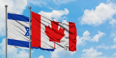 İsrail ve Kanada bayrağı birlikte beyaz bulutlu mavi gökyüzüne karşı rüzgarda sallayarak. Diplomasi kavramı, uluslararası ilişkiler.