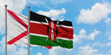 Jersey ve Kenya bayrağı birlikte beyaz bulutlu mavi gökyüzüne karşı rüzgarda sallayarak. Diplomasi kavramı, uluslararası ilişkiler.