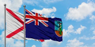 Jersey ve Montserrat bayrağı birlikte beyaz bulutlu mavi gökyüzüne karşı rüzgarda sallayarak. Diplomasi kavramı, uluslararası ilişkiler.