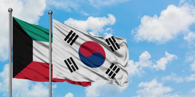 Kuveyt ve Güney Kore bayrağı birlikte beyaz bulutlu mavi gökyüzüne karşı rüzgarsal sallayarak. Diplomasi kavramı, uluslararası ilişkiler.