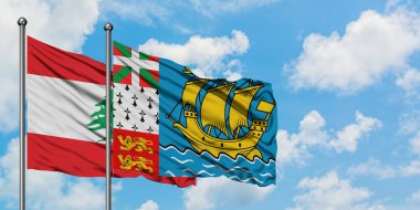 Lübnan ve Saint Pierre ve Miquelon bayrağı birlikte beyaz bulutlu mavi gökyüzüne karşı rüzgarda sallayarak. Diplomasi kavramı, uluslararası ilişkiler.