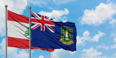 Lübnan ve İngiliz Virgin Adaları bayrağı birlikte beyaz bulutlu mavi gökyüzüne karşı rüzgarda sallayarak. Diplomasi kavramı, uluslararası ilişkiler.