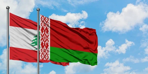 Lebanon and Belarus flag waving in the wind against white cloudy blue sky together. Diplomacy concept, international relations. — Stock Photo, Image